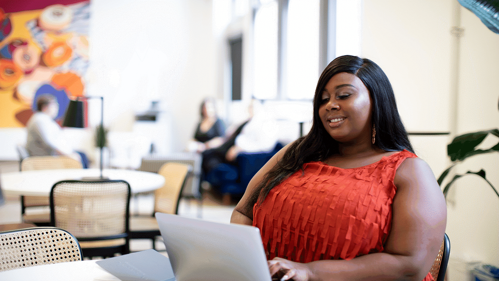 Woman at computer in cafe